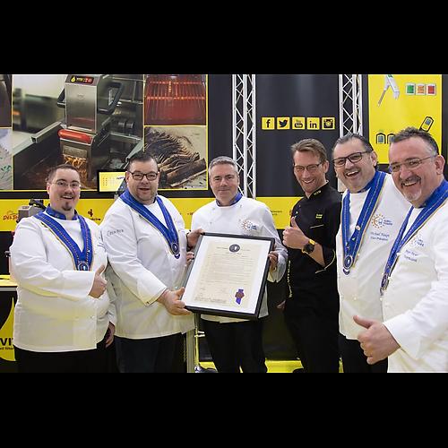 Carsten Wulf, 3. from left, gets his member certificate from Euro-Toques members and VITO AG CEO Andreas Schmidt, middle - black chef jacket